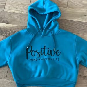 Cropped Positivity hoodie for girls. Size L (10-12). Blue and black hoodie
